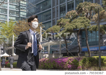 Asian man employee on the way to work Asian man employee on the way to work 79330367