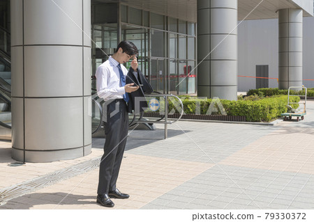 young Asian handsome man checking job interview result 79330372