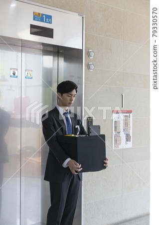 young Asian handsome employee man quitting job, holding box young Asian handsome employee man quitting job, holding box 79330570
