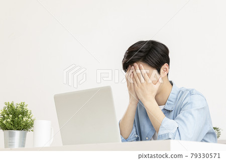 young Asian handsome man checking test, job result with laptop young Asian handsome man checking test, job result with laptop 79330571
