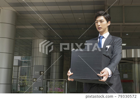young Asian handsome employee man quitting job, holding box young Asian handsome employee man quitting job, holding box 79330572