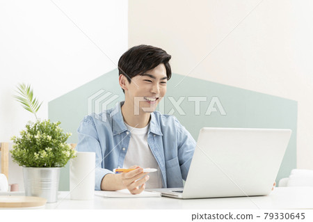 Asian handsome young man studying using laptop, online class concept Asian handsome young man studying using laptop, online class concept 79330645