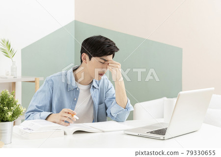 untact online education, tired Asian man college student studying with laptop untact online education, tired Asian man college student studying with laptop 79330655