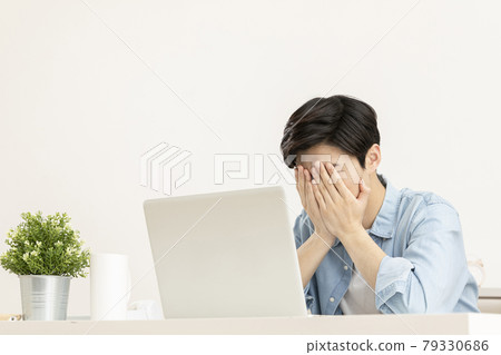 young Asian handsome man checking test, job result with laptop young Asian handsome man checking test, job result with laptop 79330686