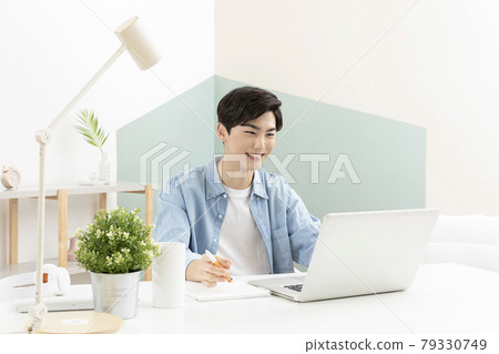 Asian handsome young man studying using laptop, online class concept Asian handsome young man studying using laptop, online class concept 79330749