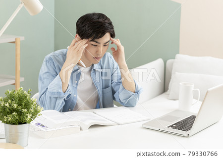 untact online education, tired Asian man college student studying with laptop untact online education, tired Asian man college student studying with laptop 79330766