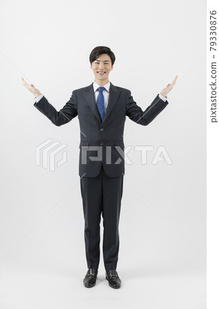 Asian man businessman employee pointing above Asian man businessman employee pointing above 79330876