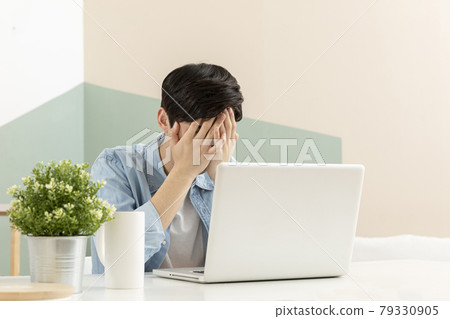 young Asian handsome man checking test, job result with laptop young Asian handsome man checking test, job result with laptop 79330905