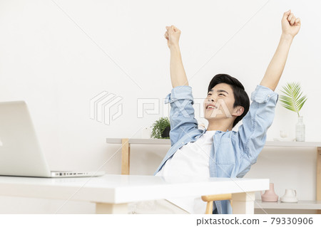 young Asian handsome man smiling, using laptop young Asian handsome man smiling, using laptop 79330906