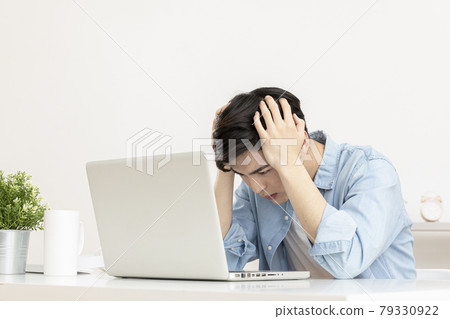 frustrated young Asian handsome man checking test, job result with laptop frustrated young Asian handsome man checking test, job result with laptop 79330922