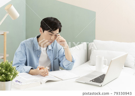 untact online education, tired Asian man college student studying with laptop untact online education, tired Asian man college student studying with laptop 79330943