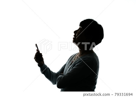 Senior female smartphone silhouette Senior female smartphone silhouette 79331694