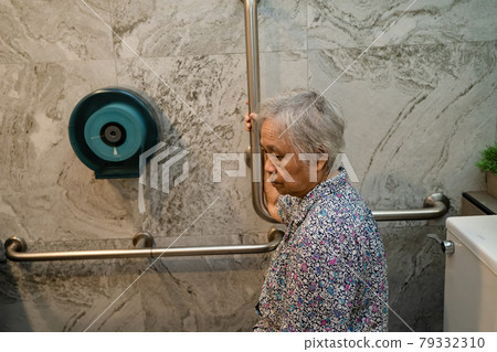 Asian senior or elderly old lady woman patient use toilet bathroom handle security in nursing hospital ward, healthy strong medical concept. Asian senior or elderly old lady woman patient use toilet bathroom handle security in nursing hospital ward, healthy strong medical concept. 79332310