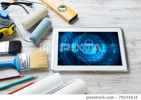 Web security and technology concept with tablet pc on wooden table 79334818