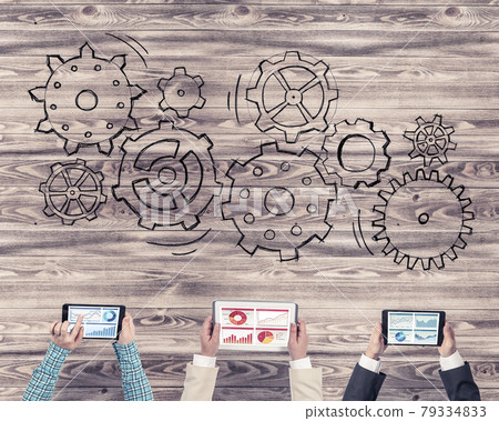 Top view of businesspeople sitting at table and using gadgets 79334833