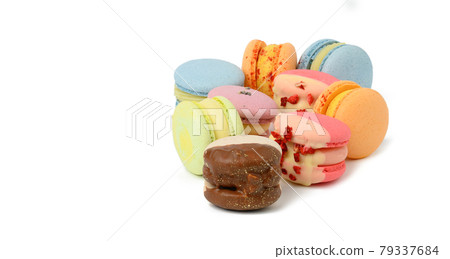 Baked round multicolored macarons on white background 79337684