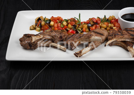 Roasted lamb ribs Roasted lamb ribs 79338039