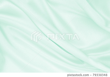 Smooth elegant green silk or satin luxury cloth texture as abstract background. Luxurious background design Smooth elegant green silk or satin luxury cloth texture as abstract background. Luxurious background design 79338348