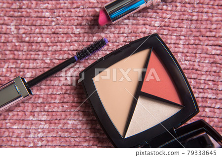 Make up face cosmetic kit: mascara, lipstick, foundation concealer, highlighter, color blush. Decorative cosmetics on pink background. Beauty and fashion concept. Make up face cosmetic kit: mascara, lipstick, foundation concealer, highlighter, color blush. Decorative cosmetics on pink background. Beauty and fashion concept. 79338645