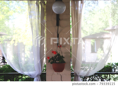 Summer restaurant terrace or veranda interior with open space. Grass decor and garden view. Summer restaurant terrace or veranda interior with open space. Grass decor and garden view. 79339115