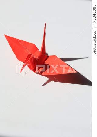 Origami red crane and white background Origami red crane and white background 79340089