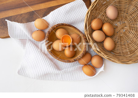 Fresh raw egg yolk. Cooking food ingredient isolated on white background. Fresh raw egg yolk. Cooking food ingredient isolated on white background. 79341408