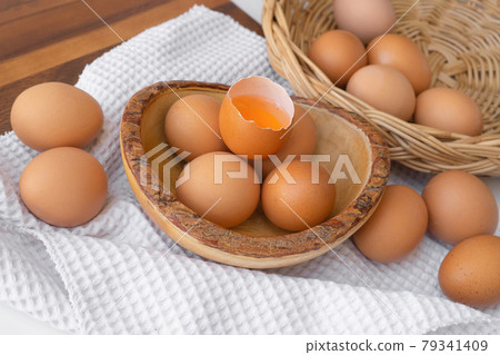 Fresh raw egg yolk. Cooking food ingredient isolated on white background. Fresh raw egg yolk. Cooking food ingredient isolated on white background. 79341409