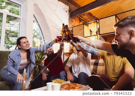 Group of young people, friends spending time together, drinking beer. Concept of friendship, leisure activity, emotions Group of young people, friends spending time together, drinking beer. Concept of friendship, leisure activity, emotions 79341522
