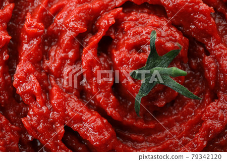 Tasty tomato paste on whole background, close up Tasty tomato paste on whole background, close up 79342120