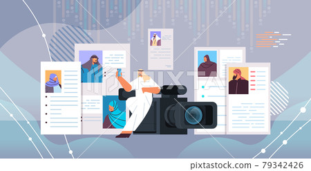 arab hr manager with video camera choosing resume curriculum vitae with photo and personal info 79342426