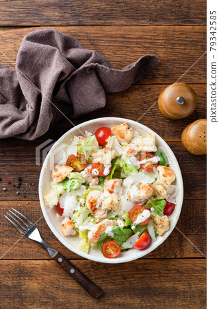 Caesar salad with grilled chicken breast Caesar salad with grilled chicken breast 79342585