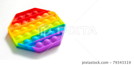 Fashionable touch bright toy antistress pop it white background copy space. Silicone toy soft bubbles to relieve stress 79343319