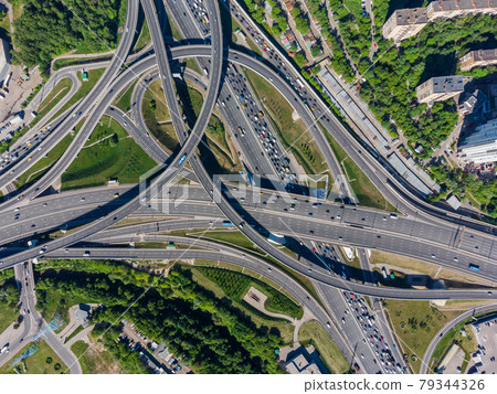 Busy multilevel junction in summer in outskirts Busy multilevel junction in summer in outskirts 79344326