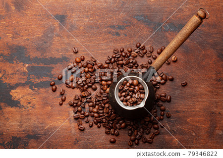 Roasted coffee beans and Turkish jezve 79346822
