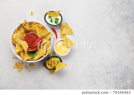 Mexican nachos chips and sauces 79346963