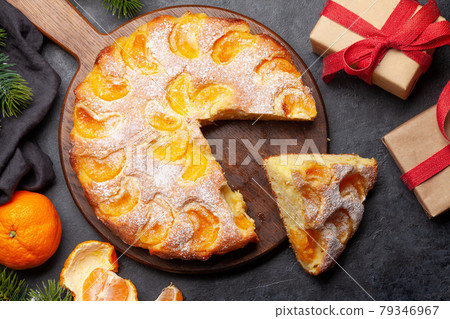 Citrus dessert holiday cake with tangerines Citrus dessert holiday cake with tangerines 79346967