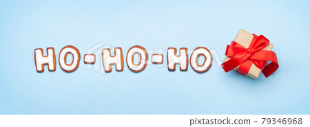 Christmas greeting card with gingerbread HO-HO-HO text Christmas greeting card with gingerbread HO-HO-HO text 79346968