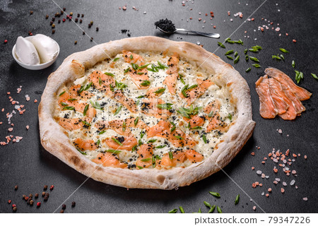Tasty sliced pizza with seafood and tomato on black background 79347226