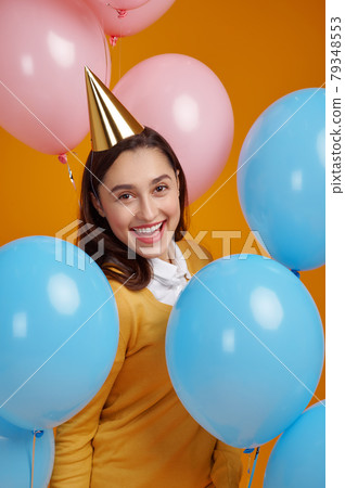 Funny woman in cap, birthday celebration 79348553