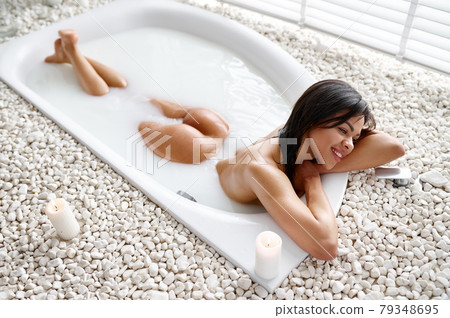 Beautiful woman, relaxation in bath with milk Beautiful woman, relaxation in bath with milk 79348695