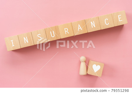 Life insurance | Building blocks with "INSURANCE" written on them, toys for homes and people, money 79351298