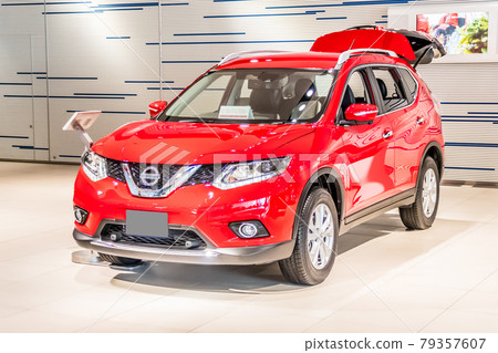 Red SUV on display in the showroom Red SUV on display in the showroom 79357607