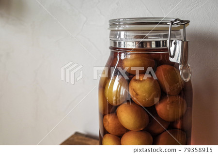 Brandy plum wine on the second day of pickling Brandy plum wine on the second day of pickling 79358915