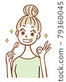 Young woman holding a toothbrush and signing OK 79360045