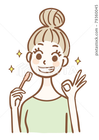 拿著牙刷和簽署OK的年輕女人 79360045