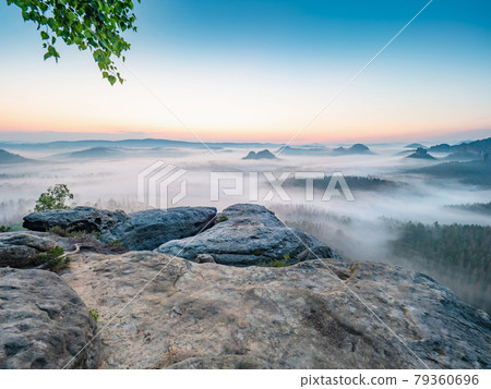 Dreamy sunrise on top of rocky mountain with view into Grosser Zschand valley Dreamy sunrise on top of rocky mountain with view into Grosser Zschand valley 79360696