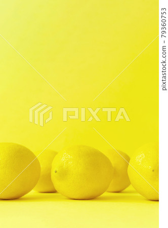 Lemon on a yellow background Lemon on a yellow background 79360753