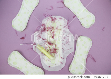 Medical conception photo. Red dreamy smile crochet blood drop, daily and menstrual pad and tampon, Woman critical days, gynecological menstruation cycle, Menstruation sanitary woman hygiene 79361707