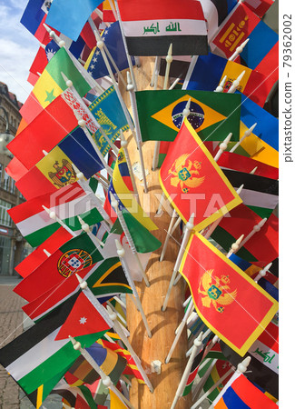A lot of different country flags for sale on side shop front close up selective focus A lot of different country flags for sale on side shop front close up selective focus 79362002
