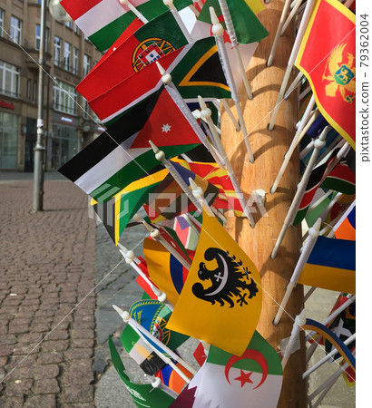 A lot of different country flags for sale on side shop front close up selective focus A lot of different country flags for sale on side shop front close up selective focus 79362004
